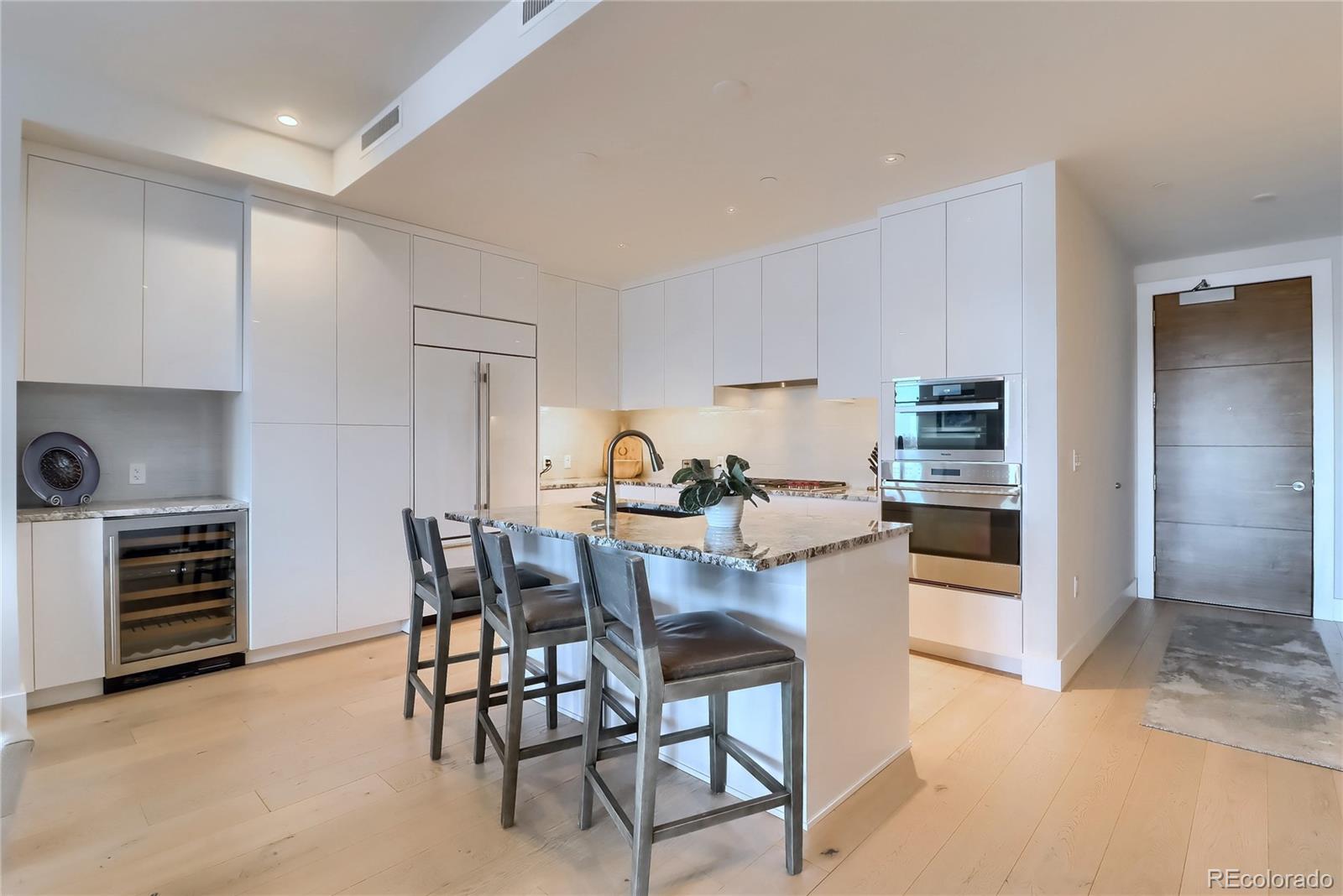 155 Steele Street, Unit 814 Denver, CO 80206 - Photo 9 of 39 a view of a dining room with furniture