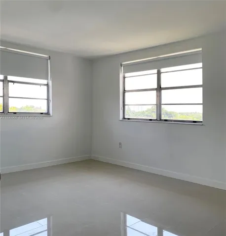 a view of a closet area with ceiling fan