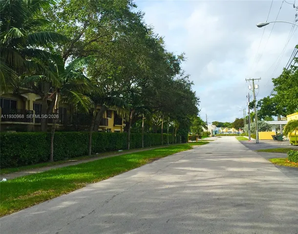 a kitchen with stainless steel appliances a stove a microwave and a refrigerator