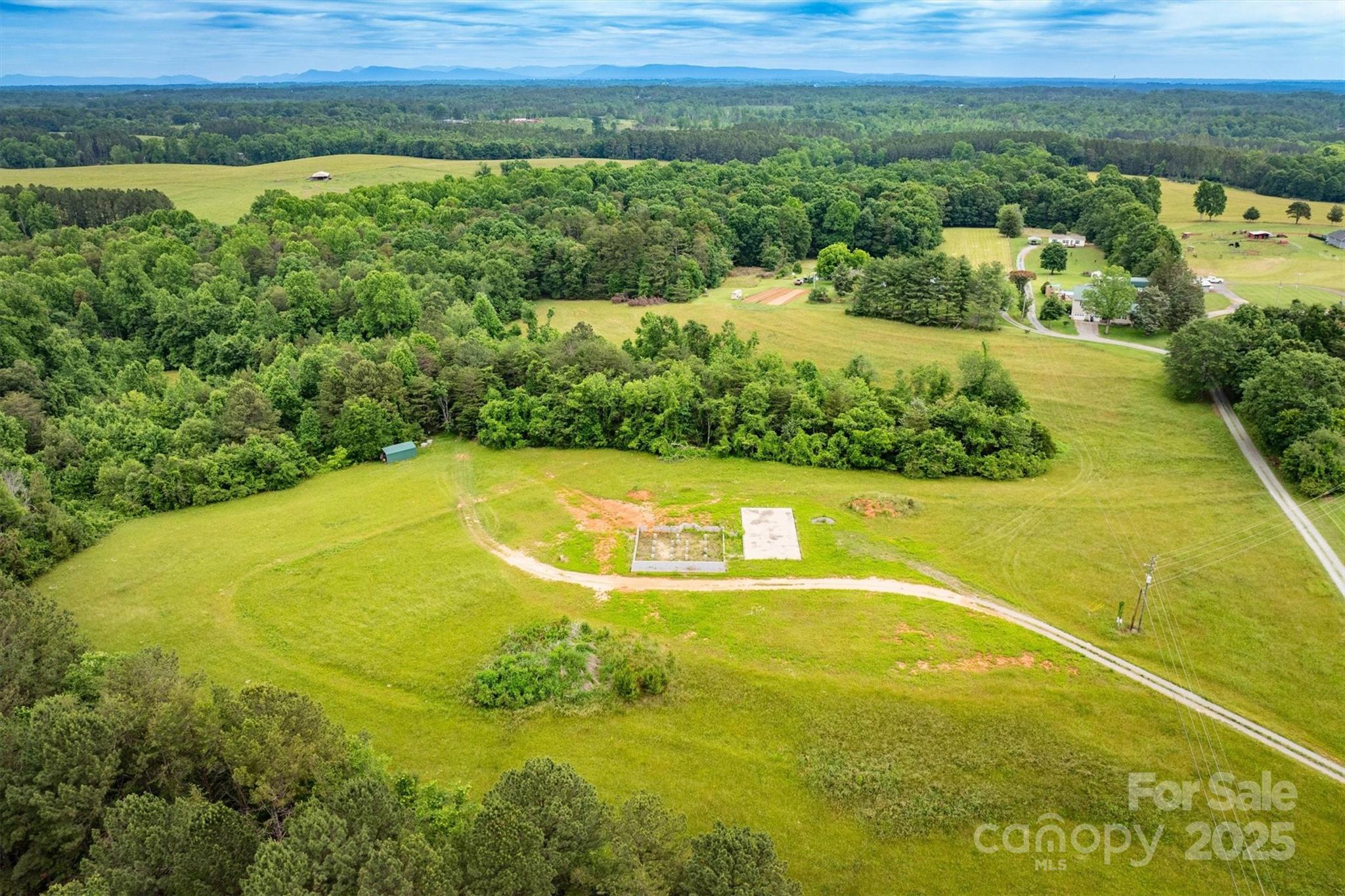 161 Windy Knoll Rutherfordton, NC 28139 - Photo 4 of 20 a view of a swimming pool and mountain view