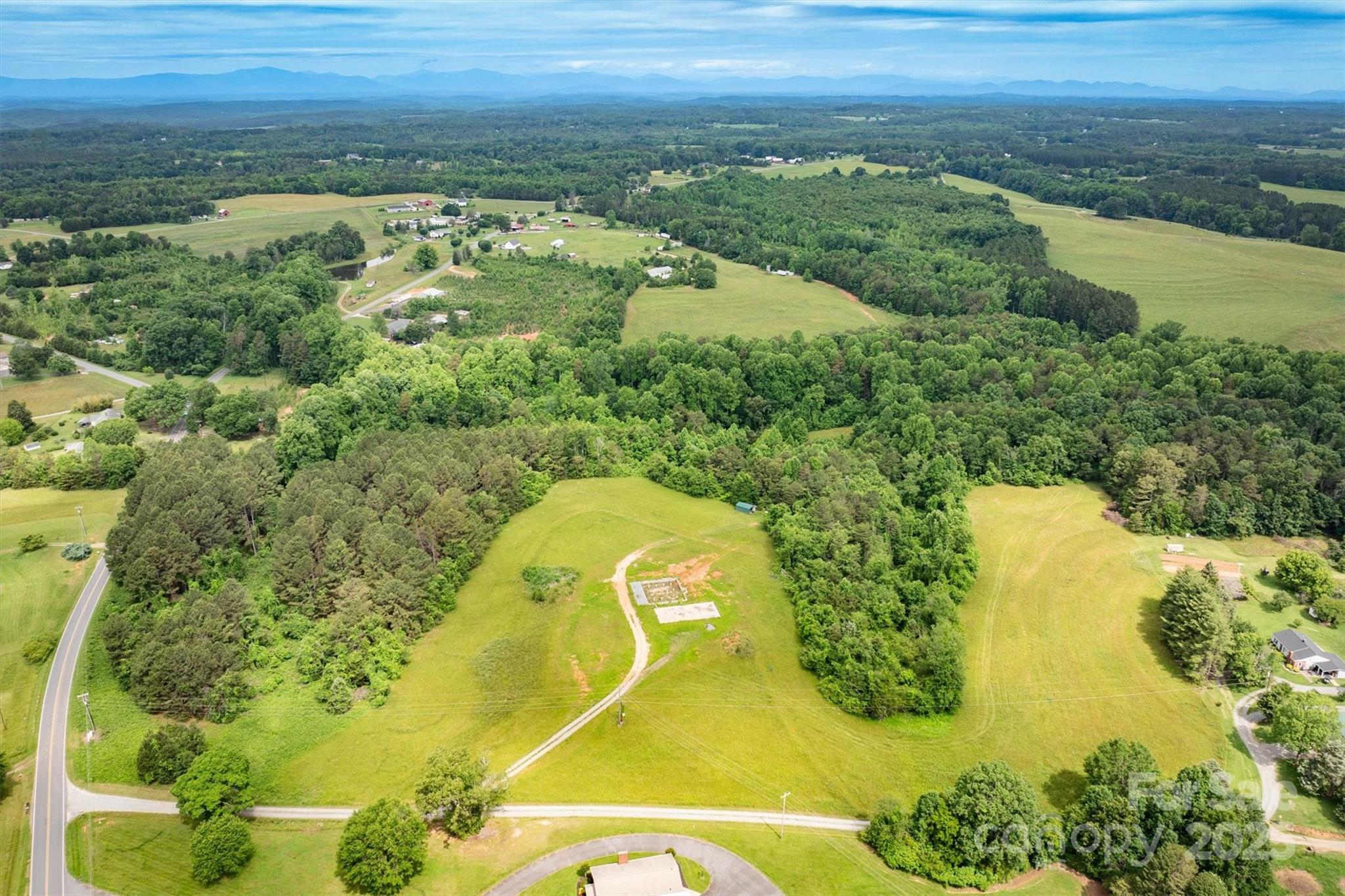 161 Windy Knoll Rutherfordton, NC 28139 - Photo 7 of 20 an aerial view of a residential houses with outdoor space and trees all around