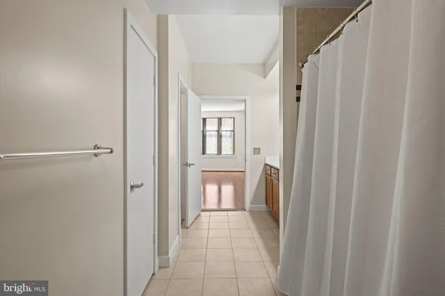 a kitchen with stainless steel appliances wooden cabinets and a stove top oven