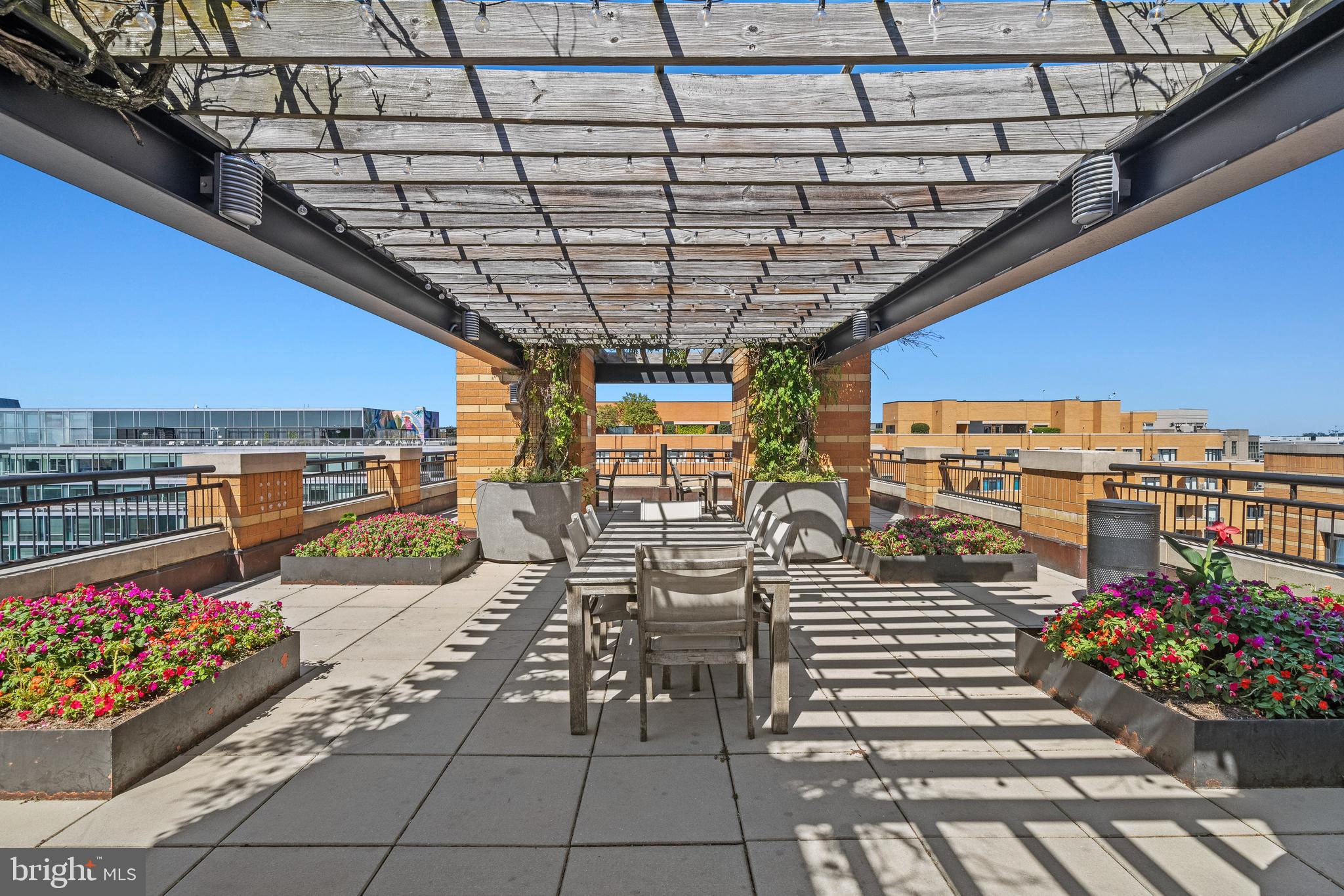 400 Massachusetts Avenue Northwest, Unit 421 Washington, DC 20001 - Photo 28 of 48 a view of a patio with dining table and chairs