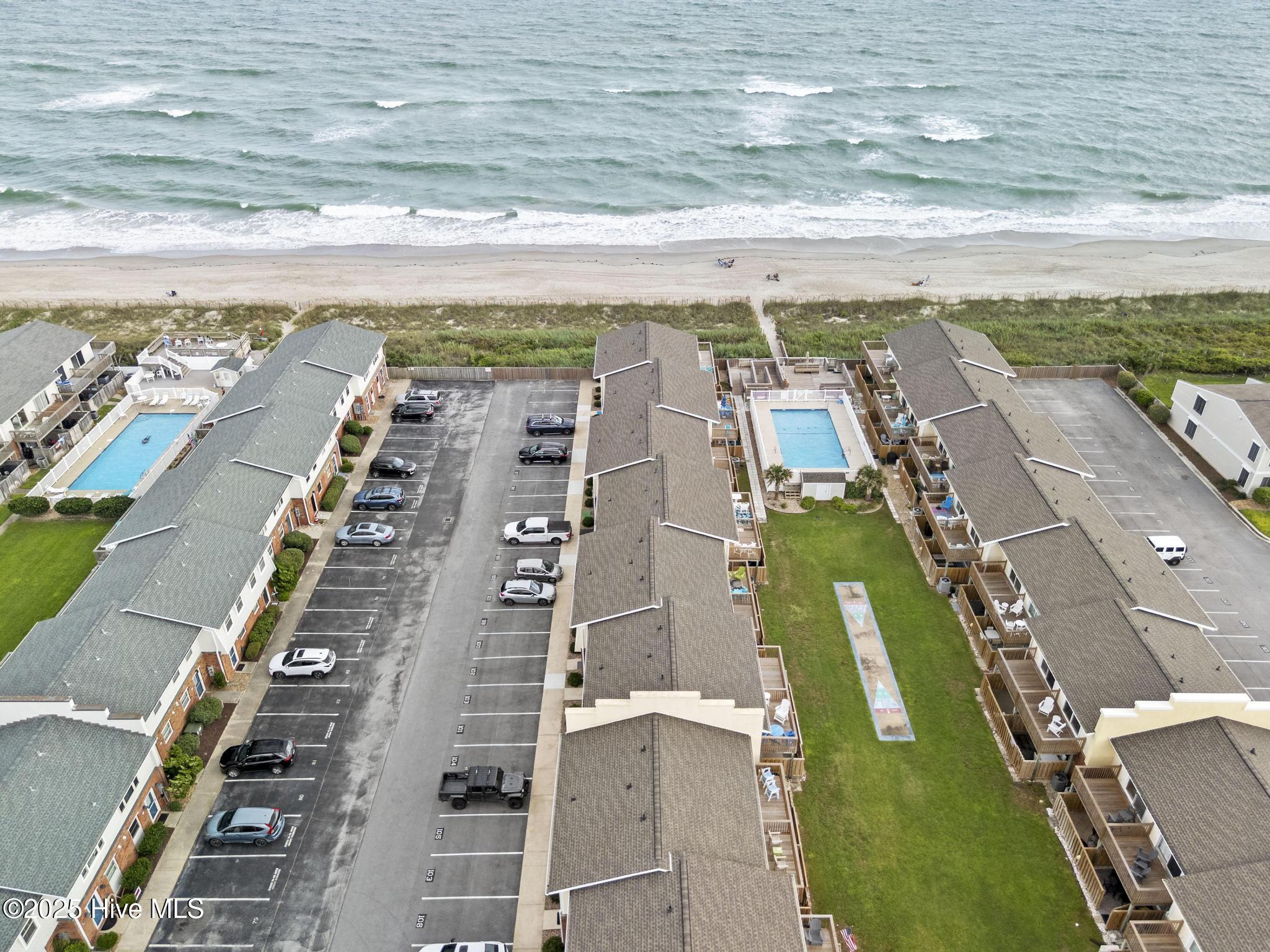 283 Salter Path Road, Unit 102 Pine Knoll Shores, NC 28512 - Photo 2 of 45 DJI_20250825175001_0072_D