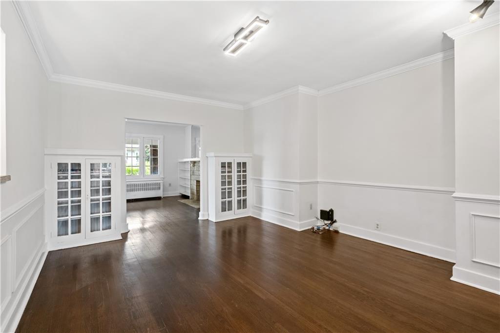 6418 Landview Road Pittsburgh, PA 15217 - Photo 17 of 45 an empty room with wooden floor and windows