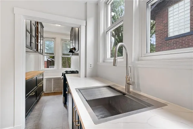 a kitchen with a stove and a sink