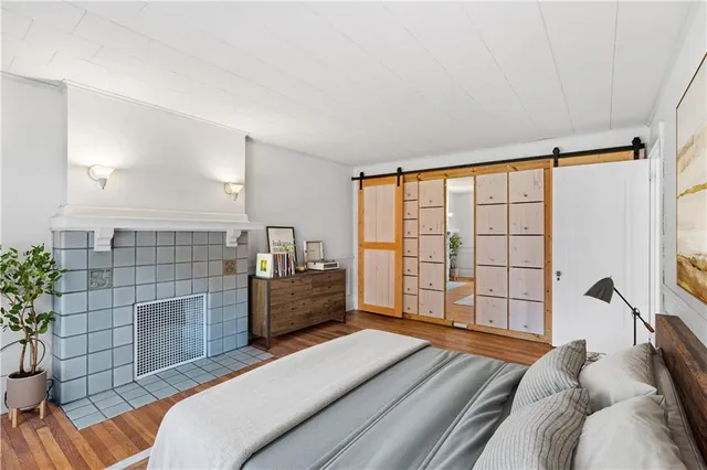 a bedroom with a bed and window