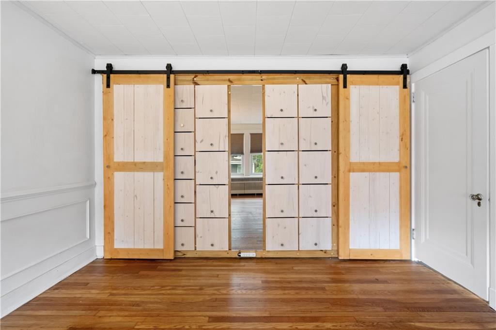 6418 Landview Road Pittsburgh, PA 15217 - Photo 25 of 45 a view of empty room with wooden floor and entryway