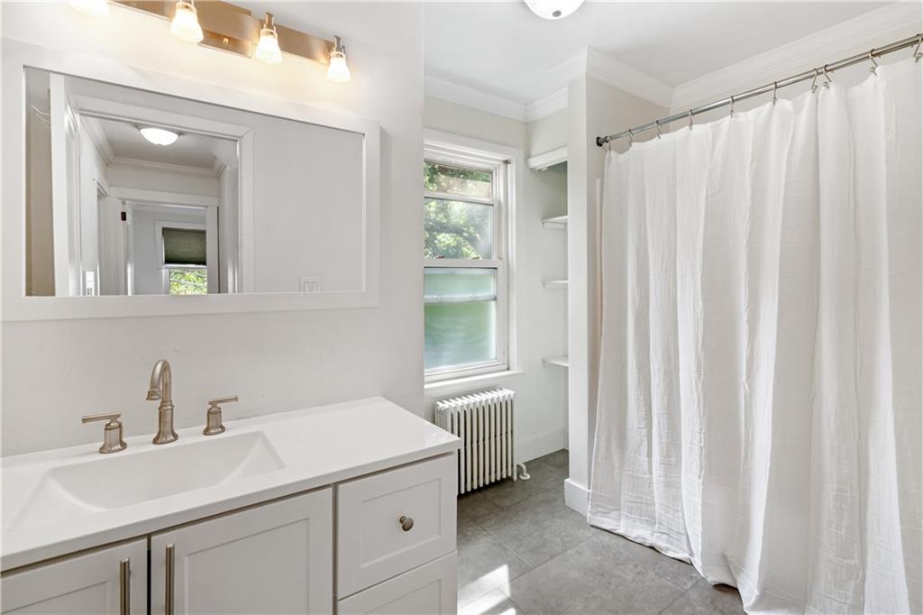 6418 Landview Road Pittsburgh, PA 15217 - Photo 29 of 45 a bathroom with a sink and a mirror