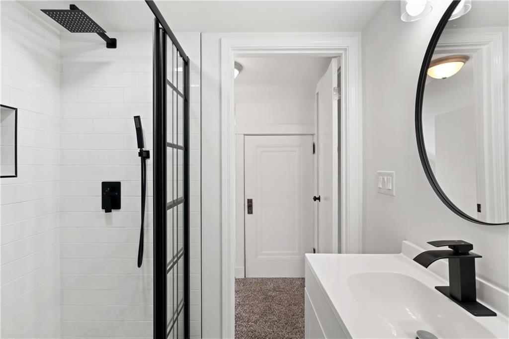 6418 Landview Road Pittsburgh, PA 15217 - Photo 35 of 45 a bathroom with a sink and a mirror