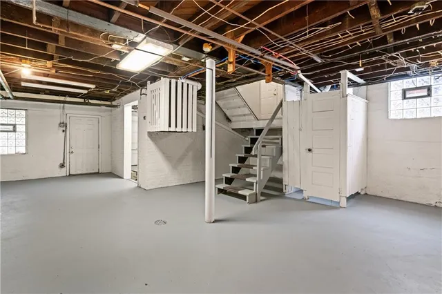 a view of a room with wooden walls