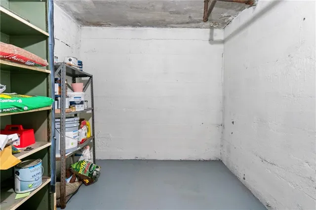 a view of walk in closet with clothes