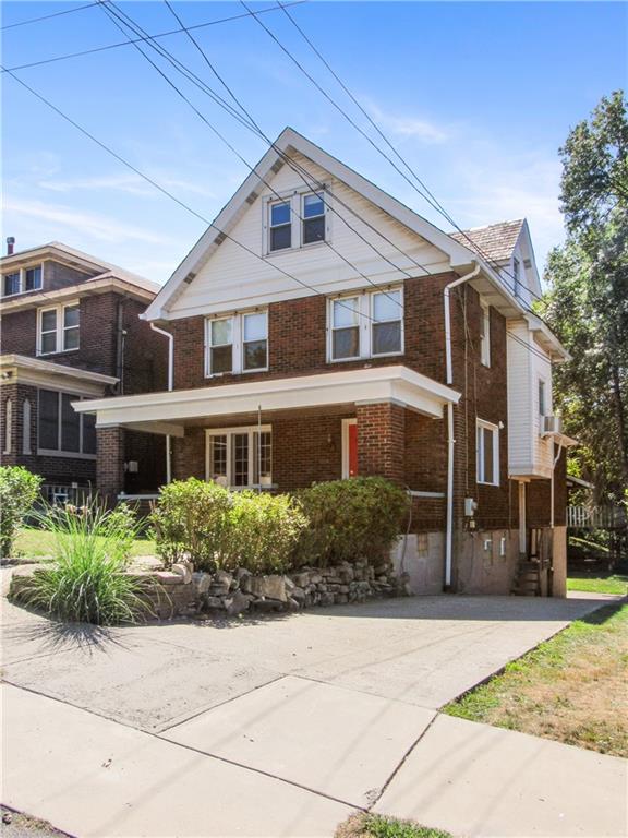 6418 Landview Road Pittsburgh, PA 15217 - Photo 44 of 45 a front view of a house with a yard