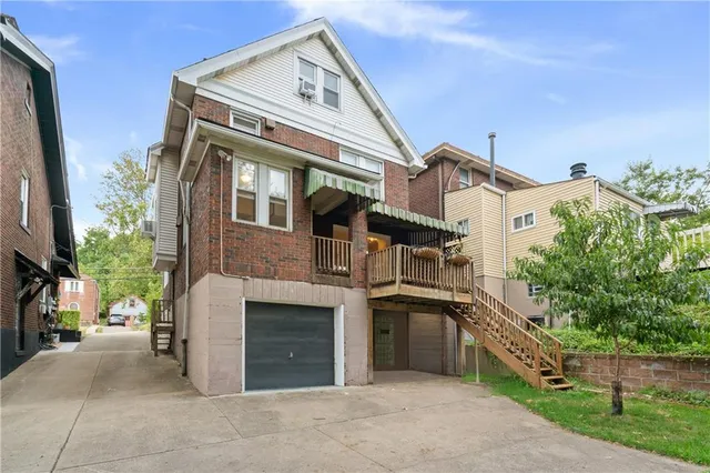 a front view of a house with a garage