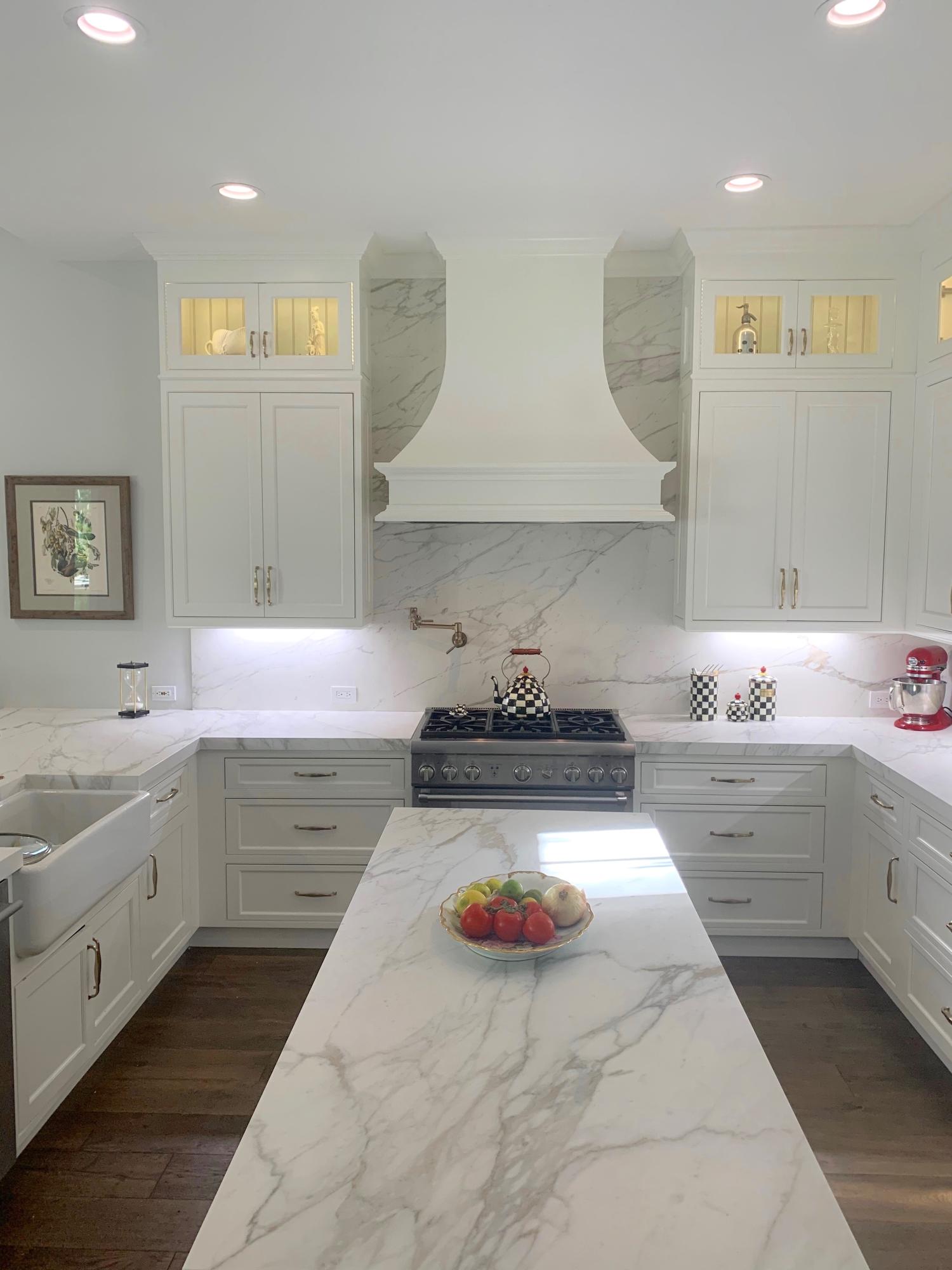 108 Santander Drive Jupiter, FL 33458 - Photo 3 of 19 a kitchen with a stove and cabinets