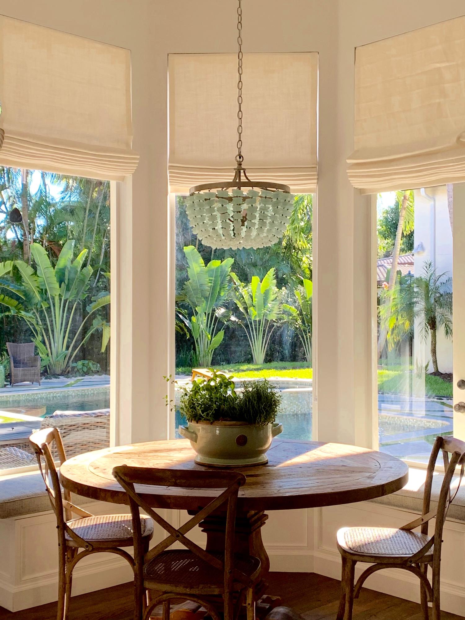 108 Santander Drive Jupiter, FL 33458 - Photo 9 of 19 a view of a dining room with furniture window and outside view