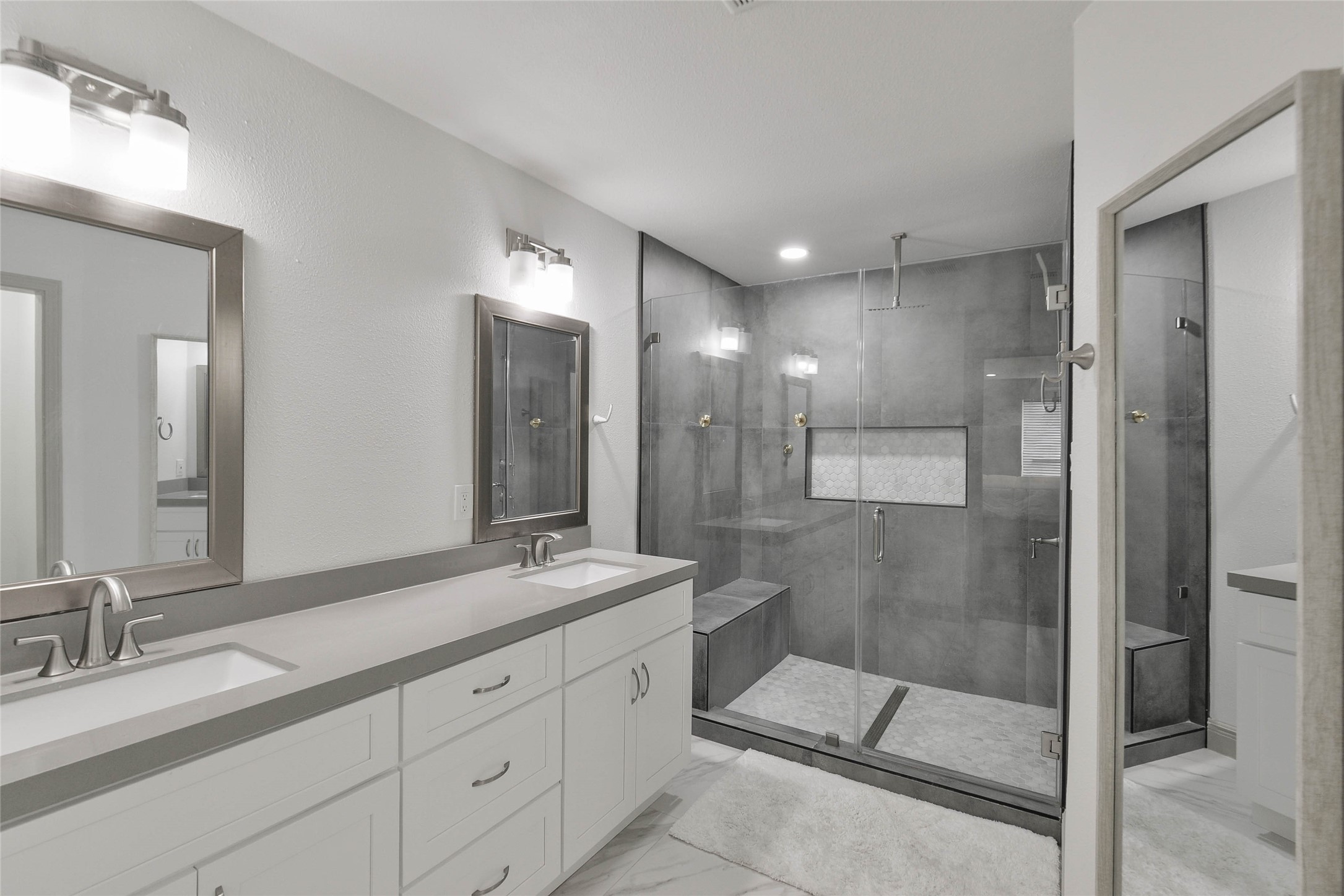 531 Brandon Road Conroe, TX 77302 - Photo 8 of 33 a bathroom with a double vanity sink mirror and shower