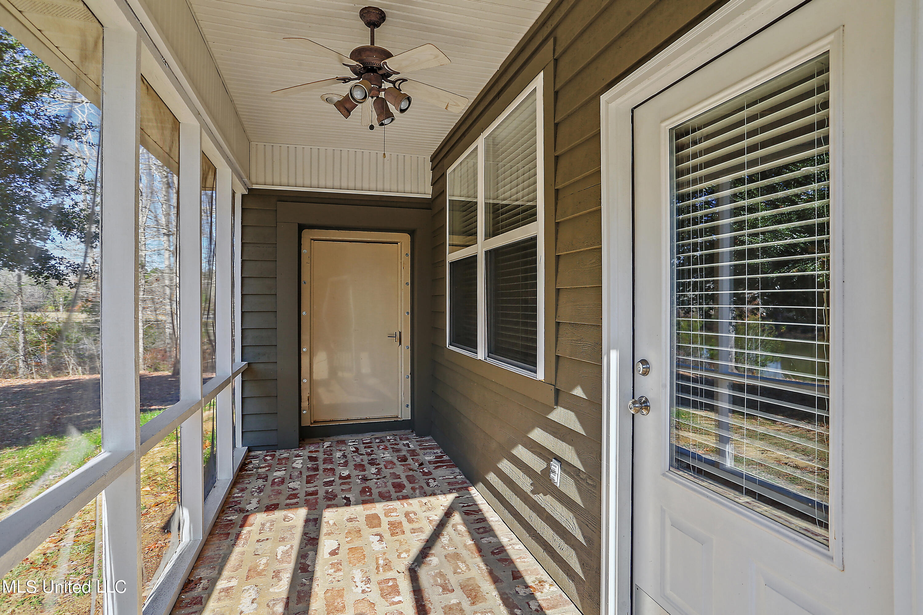 919 Ridgeside Drive Brandon, MS 39042 - Photo 26 of 38 screened in porch leading to safe room