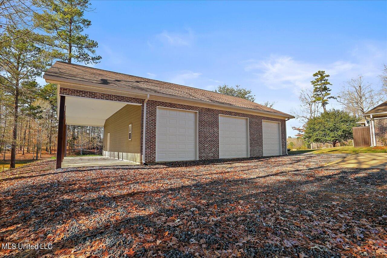 919 Ridgeside Drive Brandon, MS 39042 - Photo 36 of 38 front view of 3 bay shop