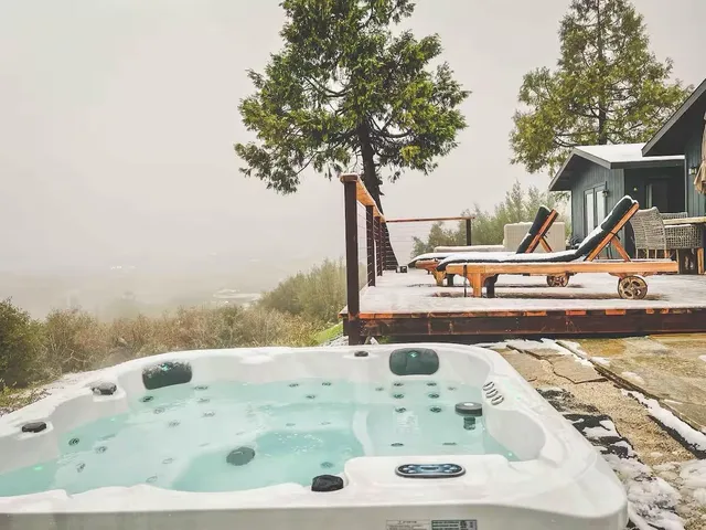 a white bath tub sitting in a bathroom and a sink