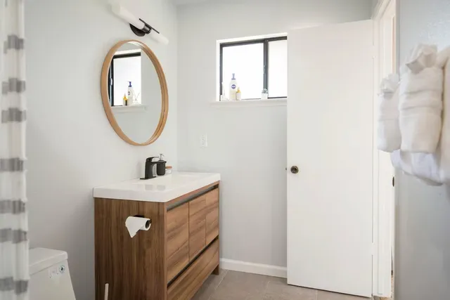 a bathroom with a sink and a mirror