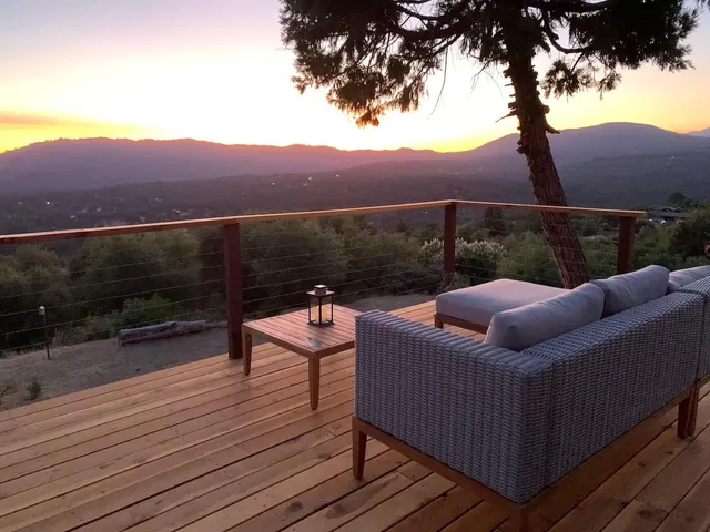 a view of a couches on the roof deck