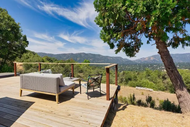 a view of roof deck with patio
