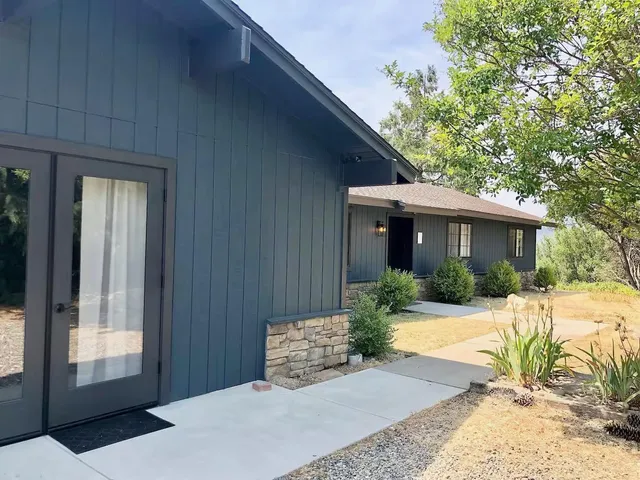 a front view of a house with a yard