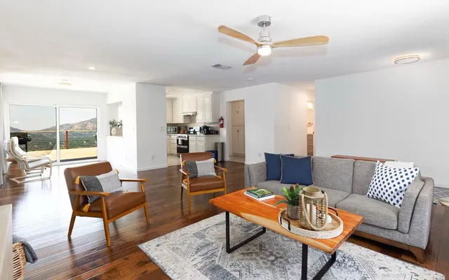 a living room with furniture and a large window