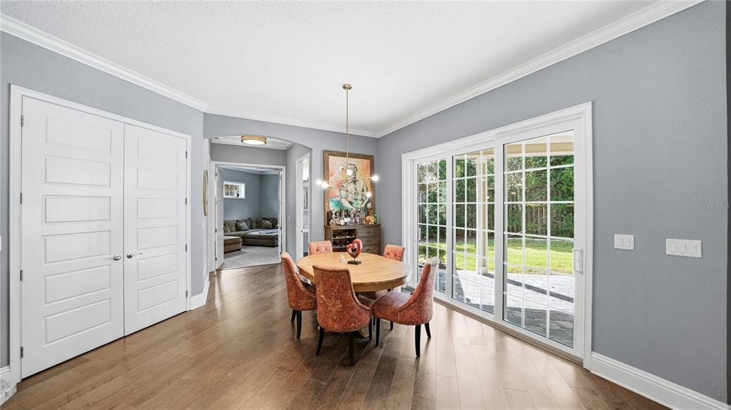 4 Flagship Court Palm Coast, FL 32137 - Photo 15 of 64 a view of a dining room with furniture window and wooden floor