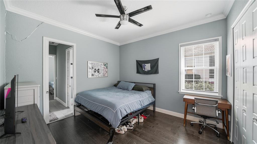 4 Flagship Court Palm Coast, FL 32137 - Photo 38 of 64 a bedroom with a bed and a desk