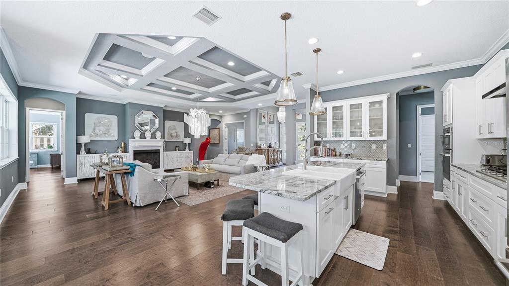 4 Flagship Court Palm Coast, FL 32137 - Photo 5 of 64 a large white kitchen with lots of counter space a sink appliances and dining table