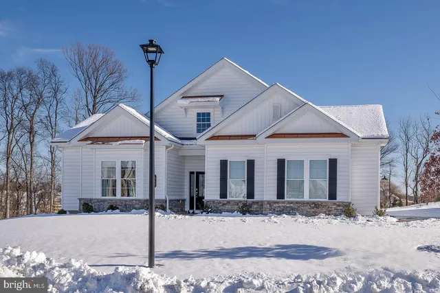 a view of a house with a wooden deck