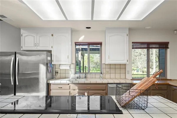 a dining room with furniture a window and wooden floor