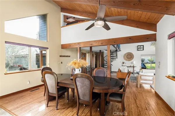 a bathroom with a granite countertop double vanity sink a mirror and shower