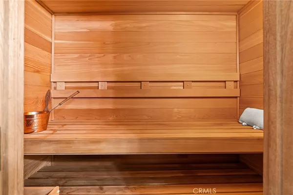 a bedroom with a bed and a flat screen television