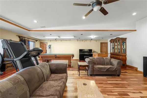 a room with pool table and windows
