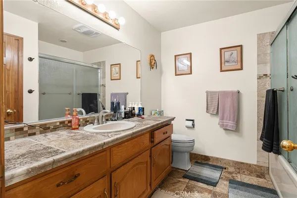 a bedroom with bed and a window