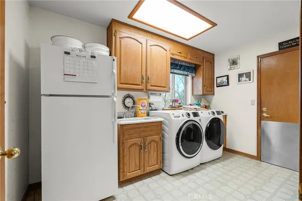 a living room with furniture and a bookshelf