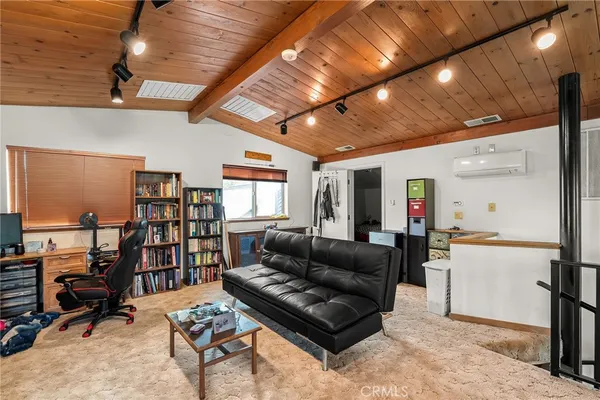 a front view of a house with garden and trees