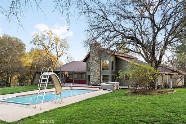 a view of a park with large trees
