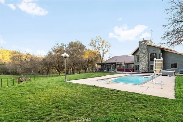 a backyard of a house with lots of green space