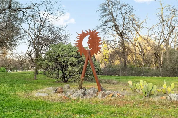 a wooden pier with boats in a lake
