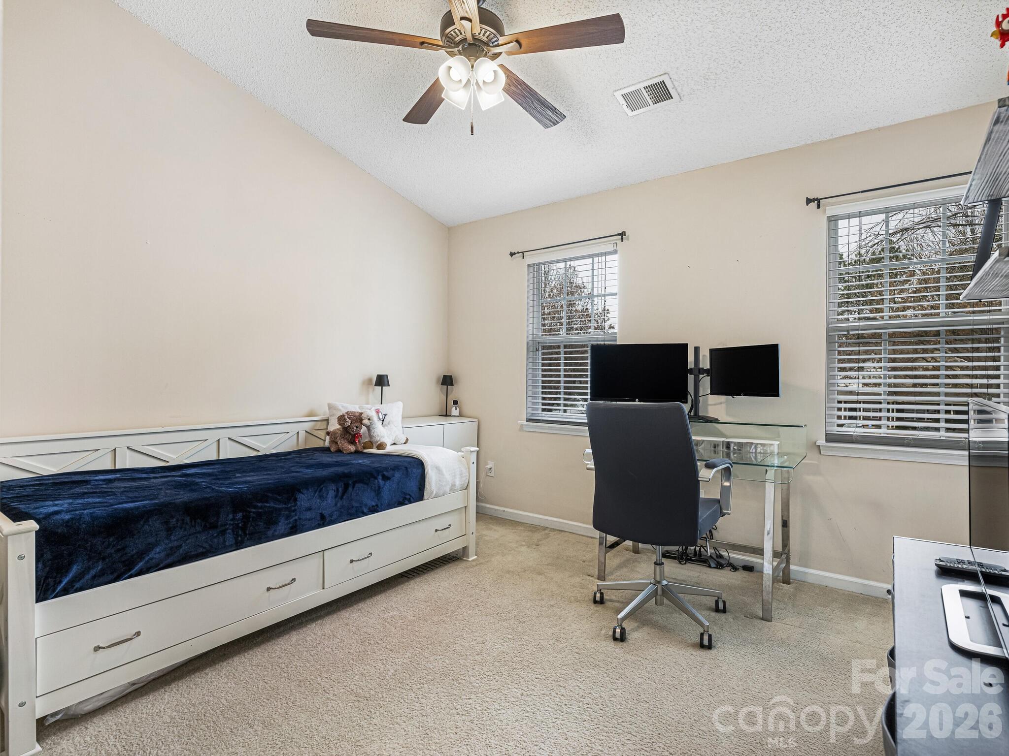 10783 Holly Ridge Boulevard Charlotte, NC 28216 - Photo 16 of 20 a bedroom with furniture and a window