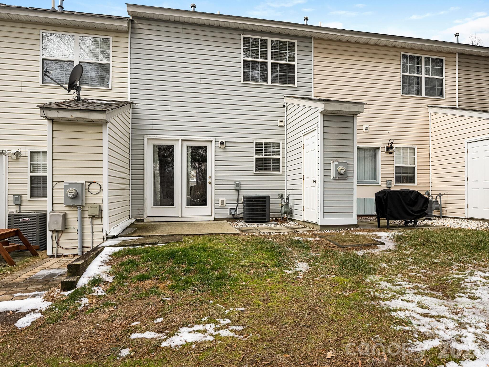 10783 Holly Ridge Boulevard Charlotte, NC 28216 - Photo 19 of 20 a view of a house with a patio