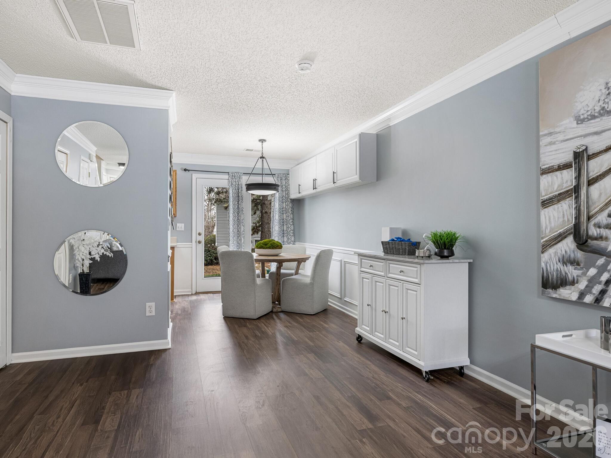 10783 Holly Ridge Boulevard Charlotte, NC 28216 - Photo 6 of 20 a living room with furniture and wooden floor