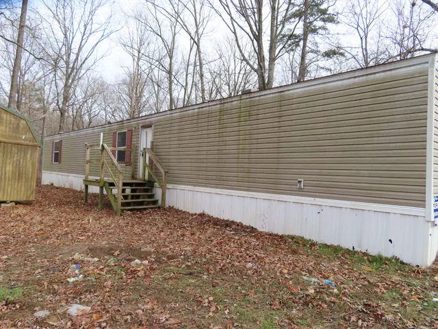a view of a back yard with a table and chair
