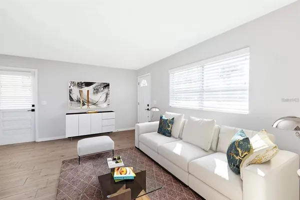 a living room with furniture and a window