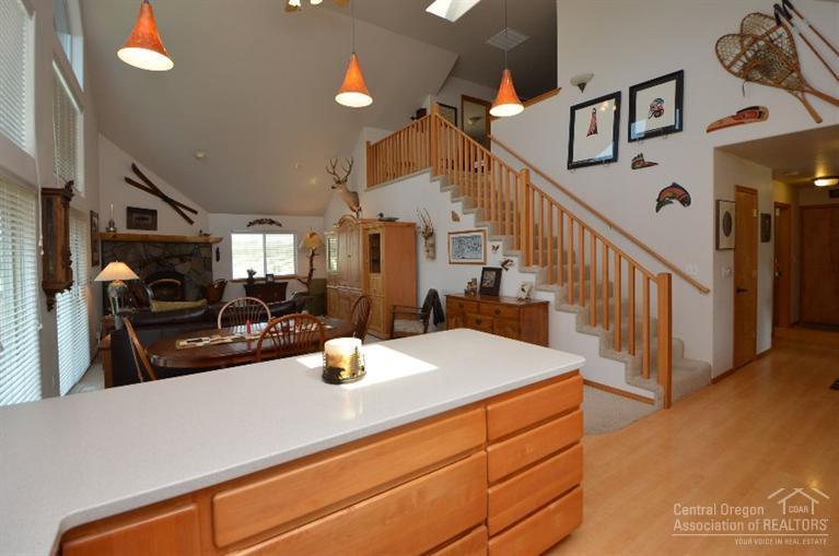 70295 Club Road Sisters, OR 97759 - Photo 12 of 25 View into great room and upper level sta