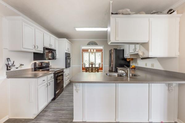 167 Edgewater Drive Temple, GA 30179 - Photo 6 of 37 a kitchen with stainless steel appliances granite countertop a sink a stove and cabinets